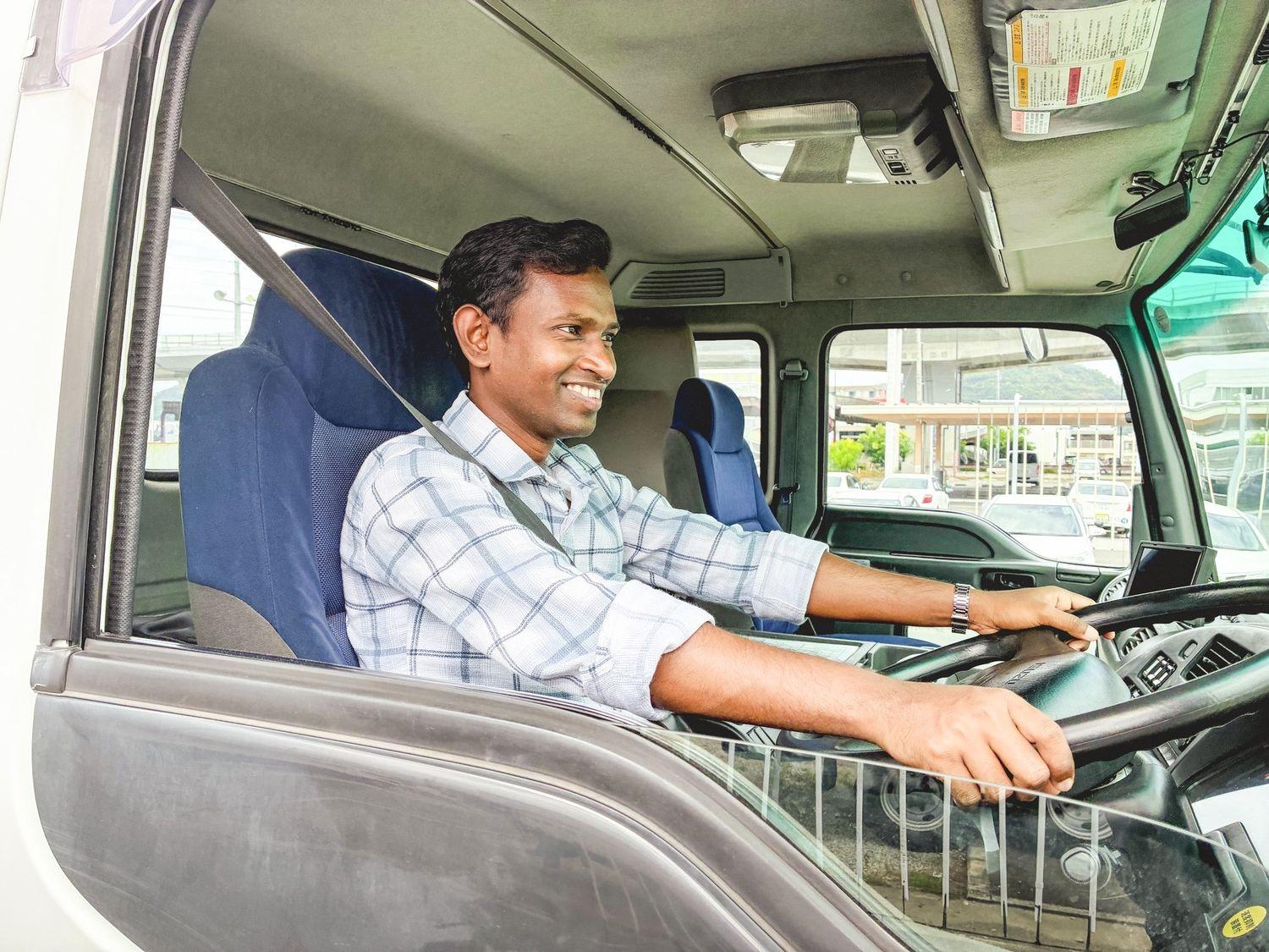 NAVIS HR-trained Indian driver at the wheel of a truck in Japan