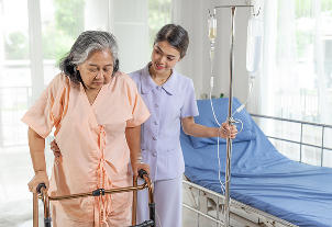 Caring nurse assisting patient